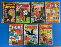Lot of 7 Marvel Comics Silver, Bronze Age - Smurfs, Annie, Jetsons, Flintstones